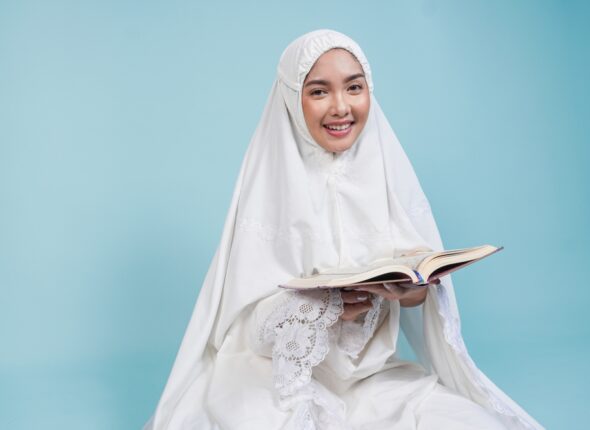 Happy,Young,Asian,Muslim,Woman,In,Prayer,Gown,Sitting,Down